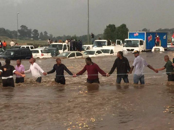 Truck driver risks life trying to save drowning woman in Joburg floods floods human chain