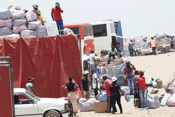ZIMRA introduces heavy fines for transit truckers to stop smuggling Hyper activity at Beitbridge bus terminus cross boarder traders busy packing and loading their goods