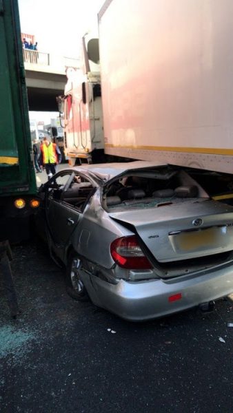 Car squashed between trucks in Germiston collision unnamed 1