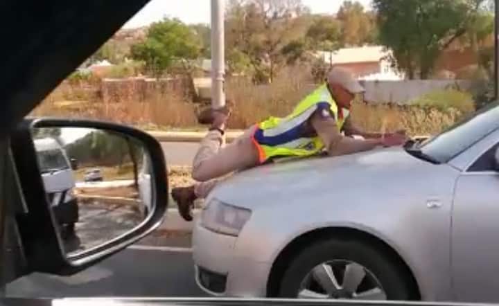 Watch: Woman arrested for driving with traffic cop hanging on her bonnet 20190918 103610