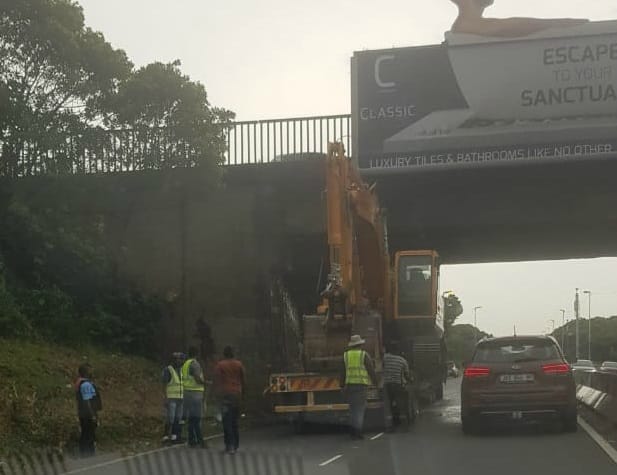 Driver tries to run after wedging truck under bridge on busy Durban freeway truck stuck on m4