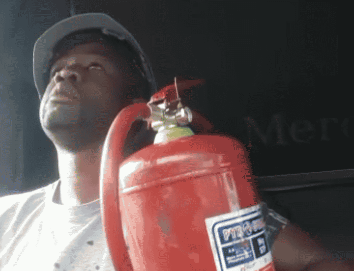 truck driver with fire extinguisher