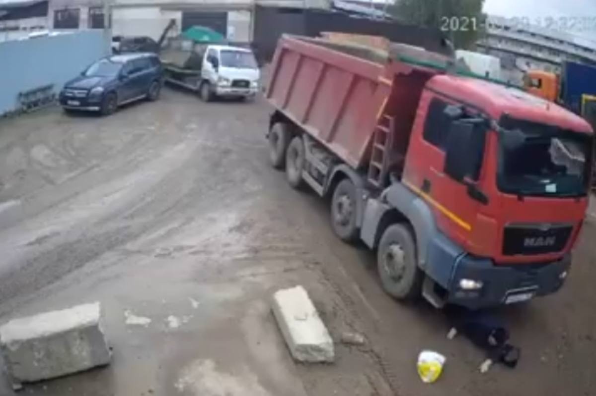 Watch: Woman Miraculously Survives Being Knocked Down By A Truck