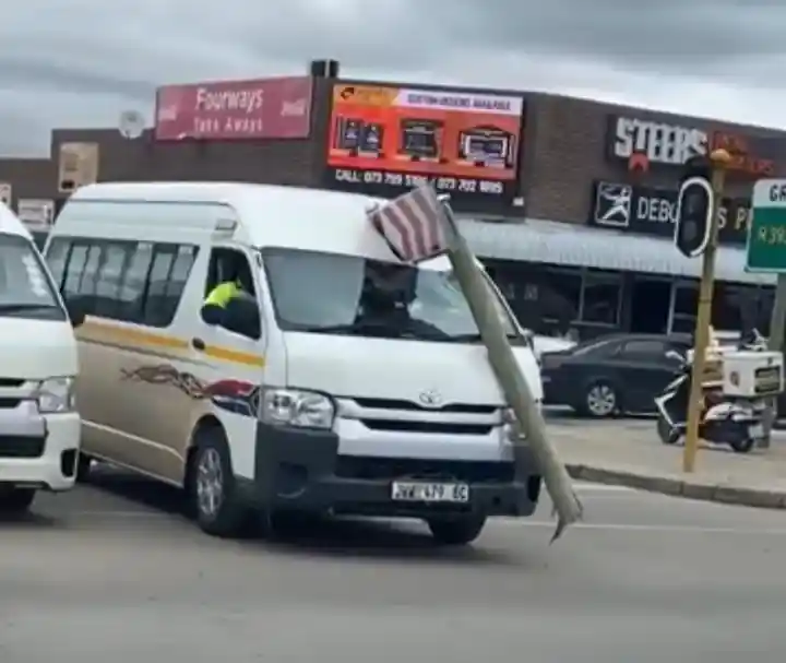 Watch: Minibus taxi driving around with road it crashed into stuck in its face