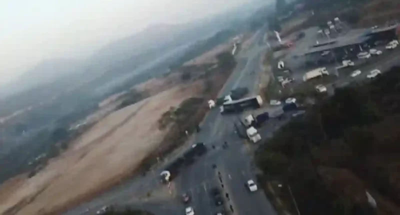 aerial view of trucks blocking road in mbombela strike